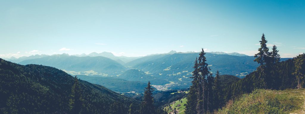 Mountainous landscape under a clear blue sky.